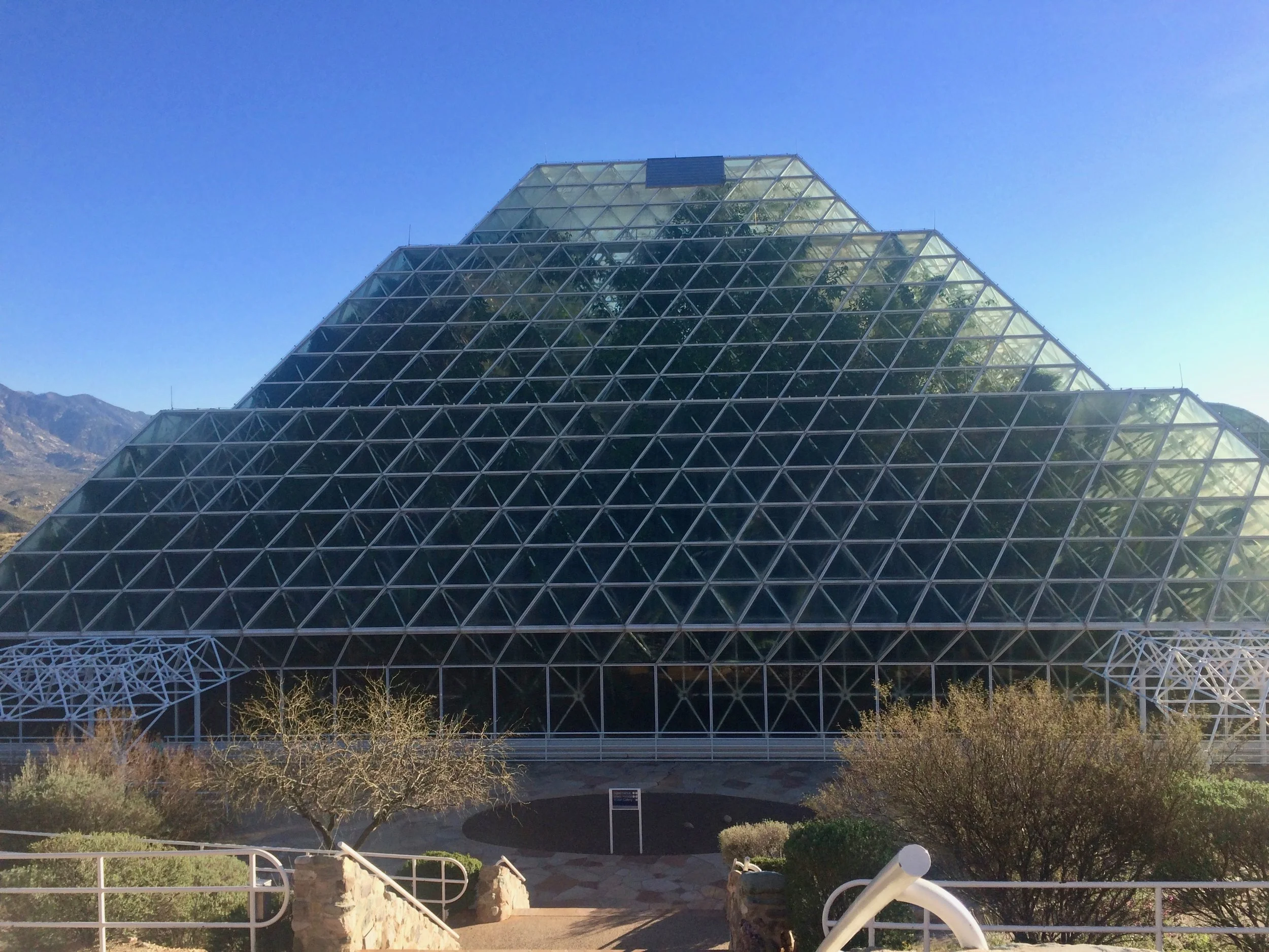 A broad frontal view of Biosphere 2’s tiered glass greenhouse.