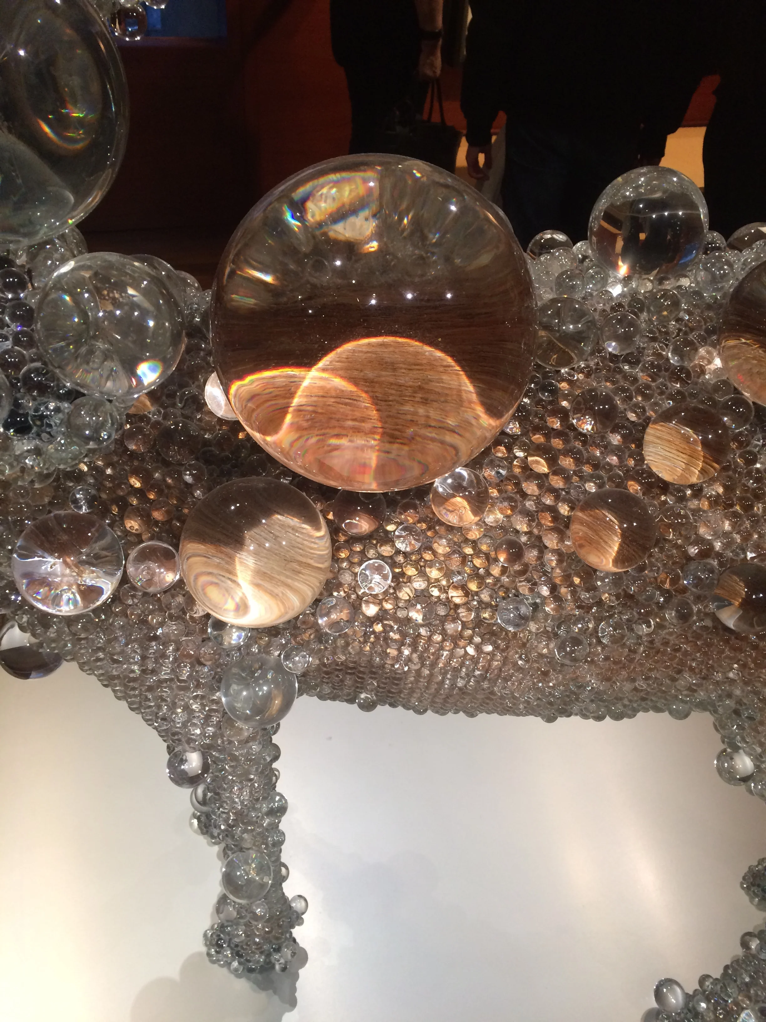 Close-up of the clear glass bubbles covering the deer sculpture’s torso and legs.